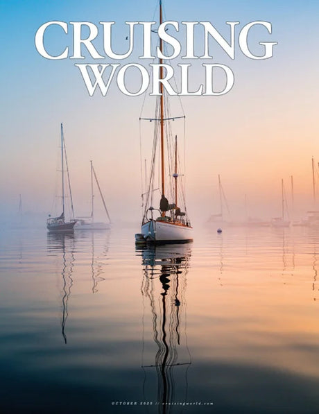 Magazine cover titled 'Cruising World' with sailboats on a calm water surface.