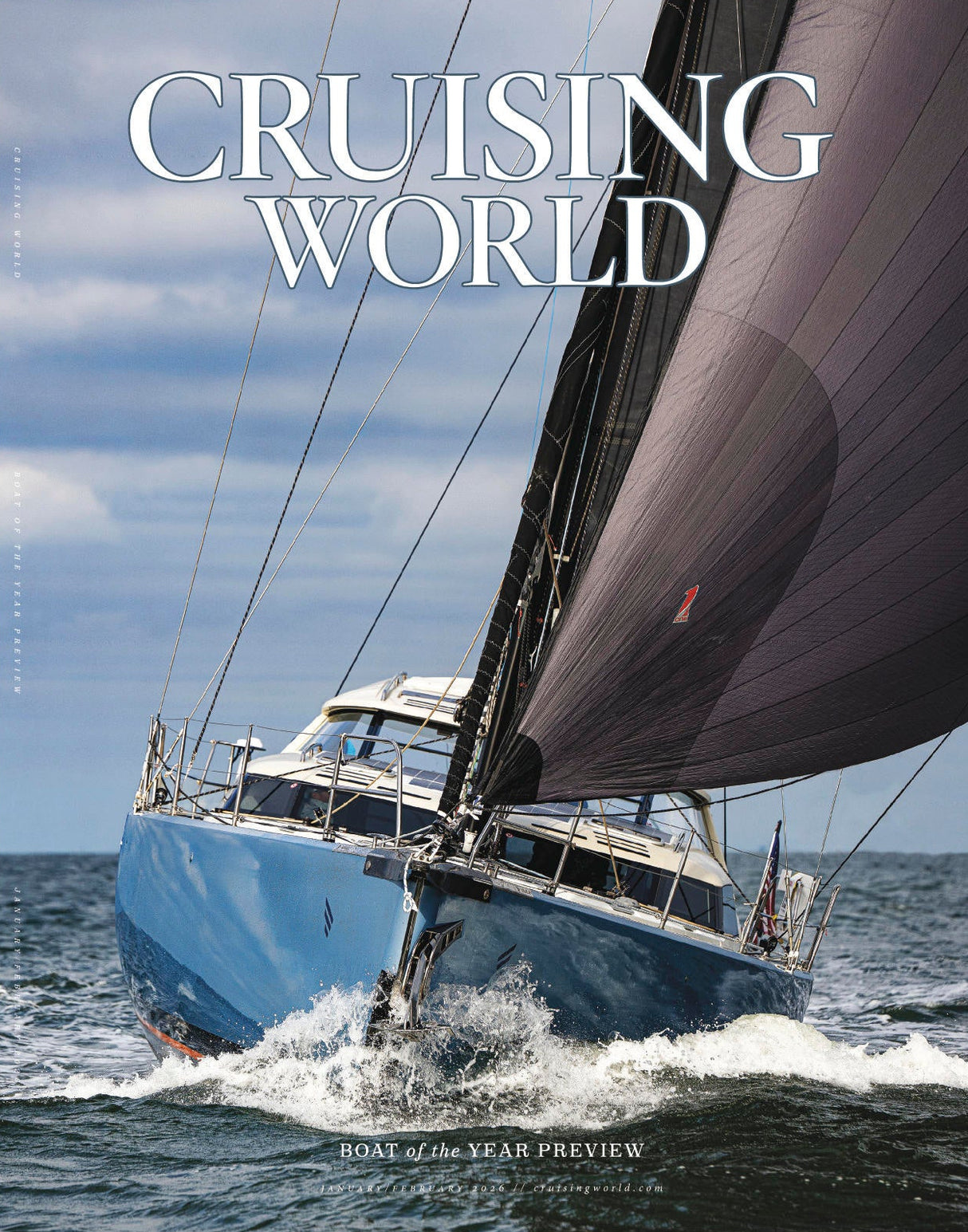 Sailing yacht on the water with 'Cruising World' magazine cover text.