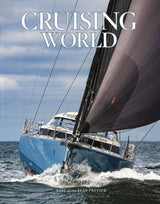 Sailing yacht on the water with 'Cruising World' magazine cover text.