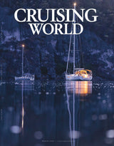 Two sailboats on a calm lake with 'Cruising World' text above.