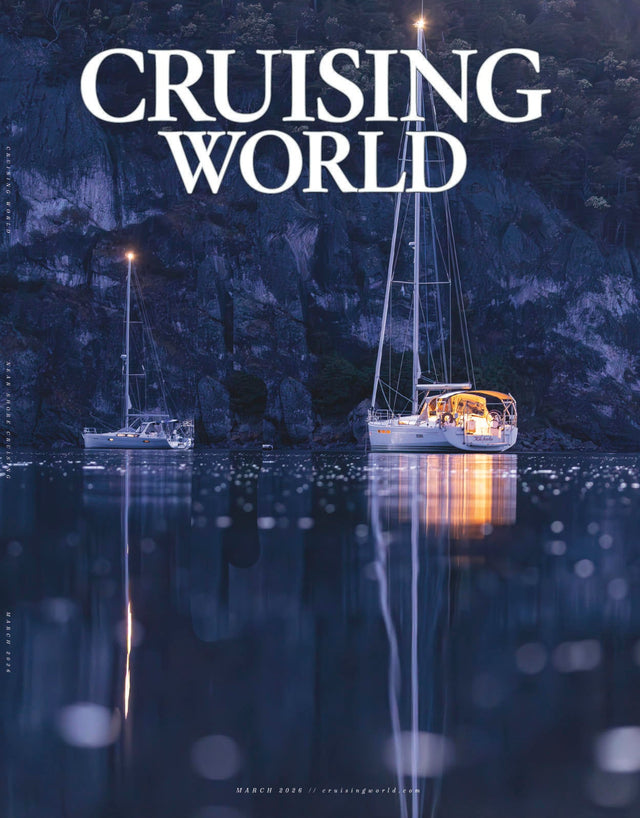 Two sailboats on a calm lake with 'Cruising World' text above.
