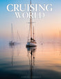 Magazine cover titled 'Cruising World' with sailboats on a calm water surface.