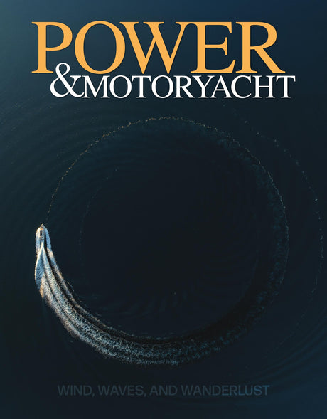 Cover of 'Power & Motoryacht' magazine with a boat trail on water.