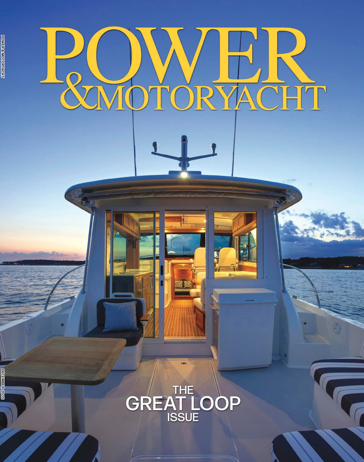 Magazine cover of 'Power & Motoryacht' featuring a luxurious yacht on a blue sky and water background.