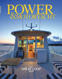 Magazine cover of 'Power & Motoryacht' featuring a luxurious yacht on a blue sky and water background.