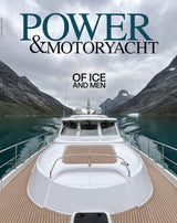 Yacht on a mountainous lake with text 'Power & Motoryacht: Of Ice and Men'.