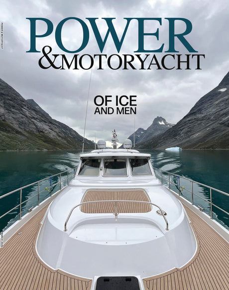 Yacht on a mountainous lake with text 'Power & Motoryacht: Of Ice and Men'.