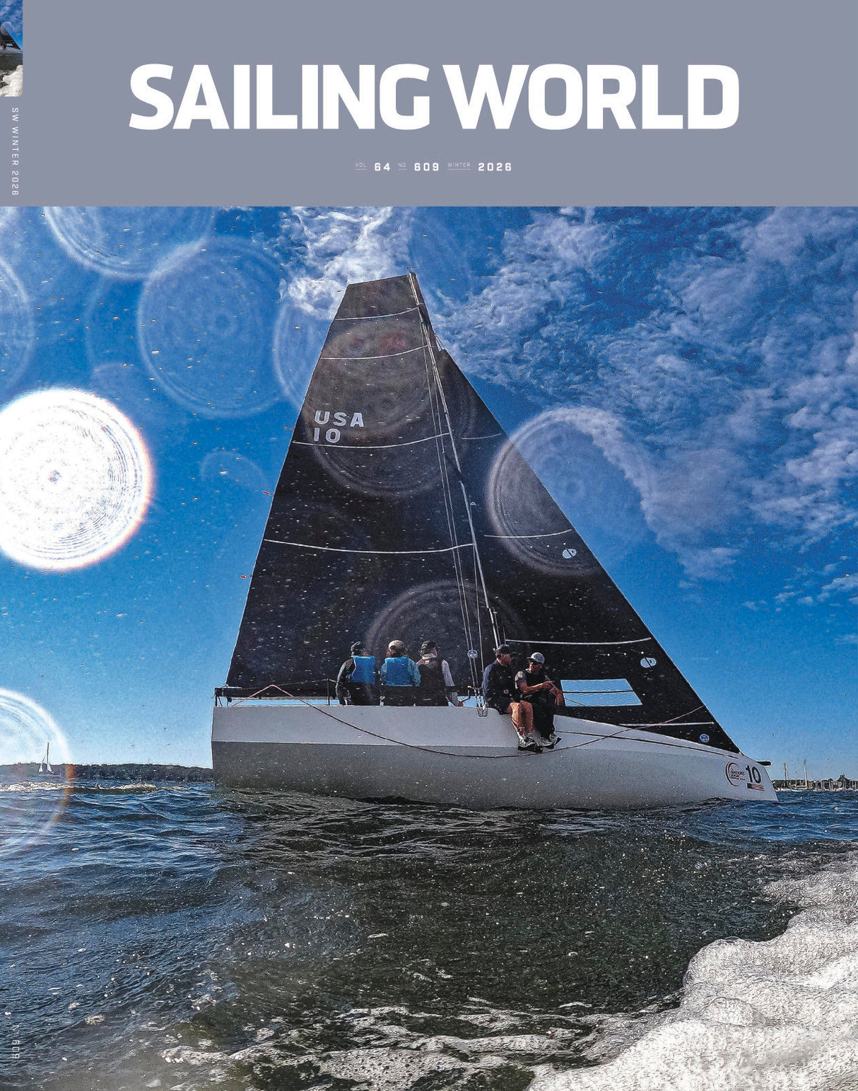 Sailing World magazine cover with a sailboat on the water