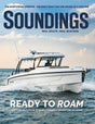 Magazine cover featuring a boat on the water with 'Soundings' branding.
