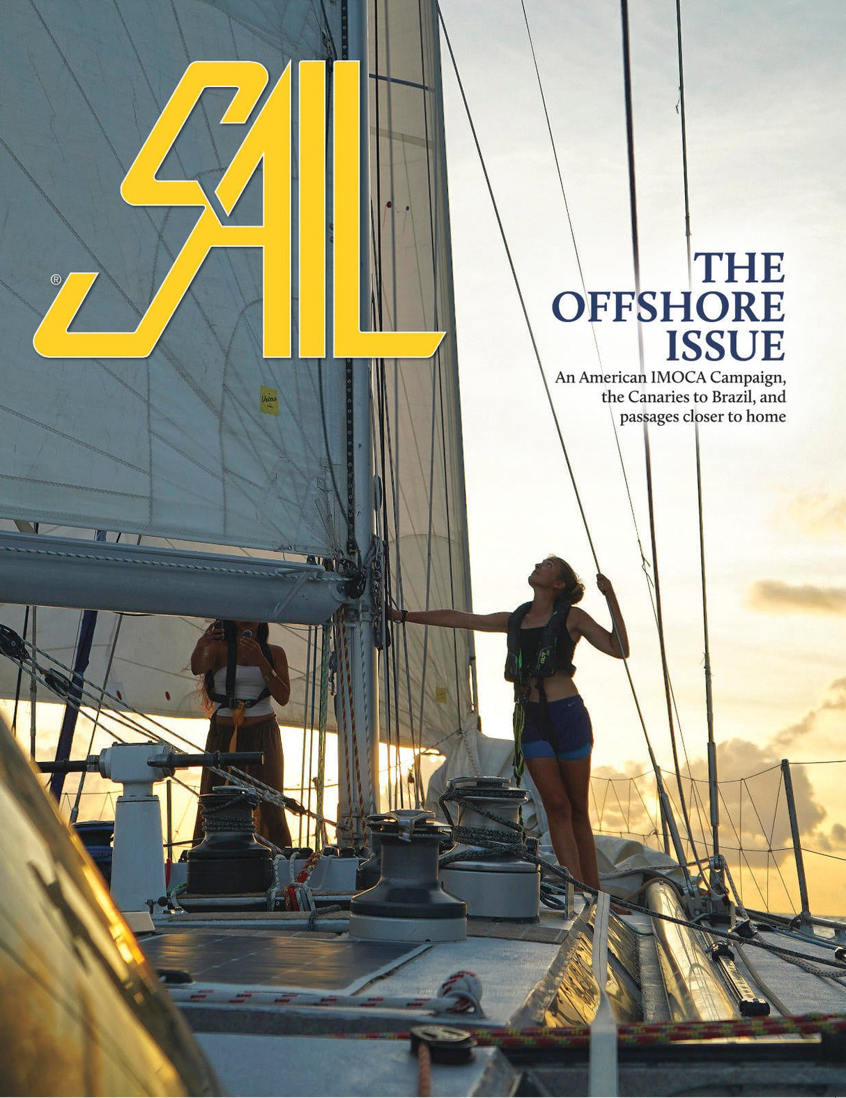 Sail magazine cover with two people on a sailboat at sunset, featuring the magazine's logo and text.