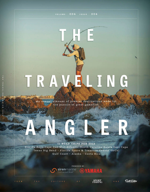Magazine cover for 'The Traveling Angler' with a person fishing on rocks and ocean waves.