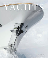 Yachts International magazine cover with a yacht cutting through water