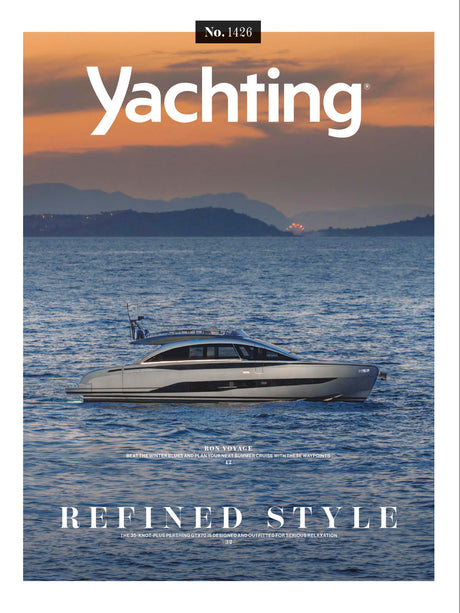 Yachting magazine cover with a yacht on the water and mountains in the background