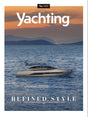 Yachting magazine cover with a yacht on the water and mountains in the background